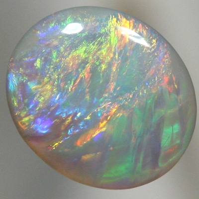 SOLID SEMI BLACK OPAL Pretty opal. Red and orange over green and purple. With VIDEO